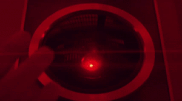 This gif depicts Dr. Chandra, one of the characters in 2010: The Year We Make Contact, gently tapping on Hal's fisheye lense after reactivating him.