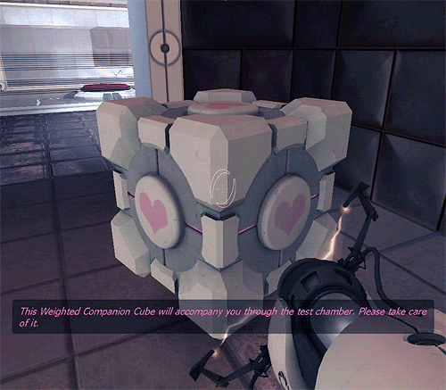 GIF of the companion cube being held up by the portal gun.