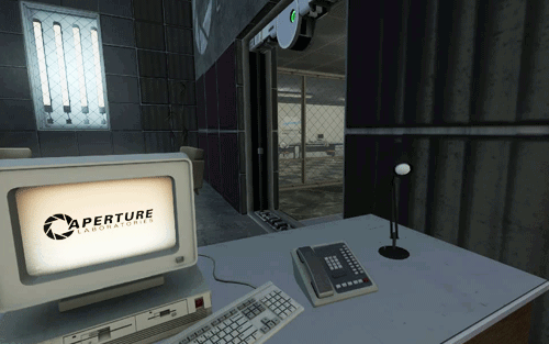 GIF of a desk somewhere within Aperture Science. On the desk is a computer who's monitor is displaying an animated Aperture Science logo. Next to it sits a telephone, and a small lamp.