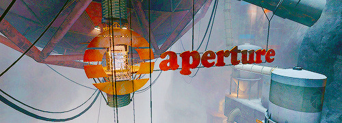 Image of one of the signs displaying an old Aperture logo as it sits just below an Enrichment Sphere.